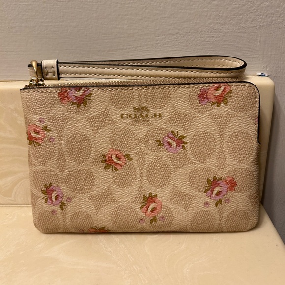 Coach Handbags - Coach Cream and Pink Floral Wristlet